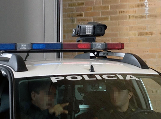 A surveillance camera mounted on a car