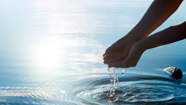 Image of scooping water by hand